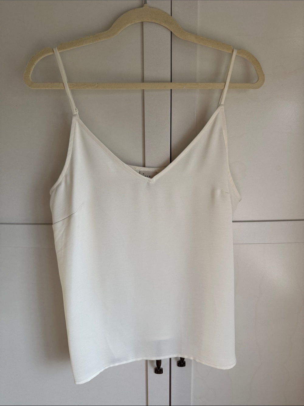 Classic White V-Neck Spaghetti Strap Cami. Silk looking with adjustable straps.